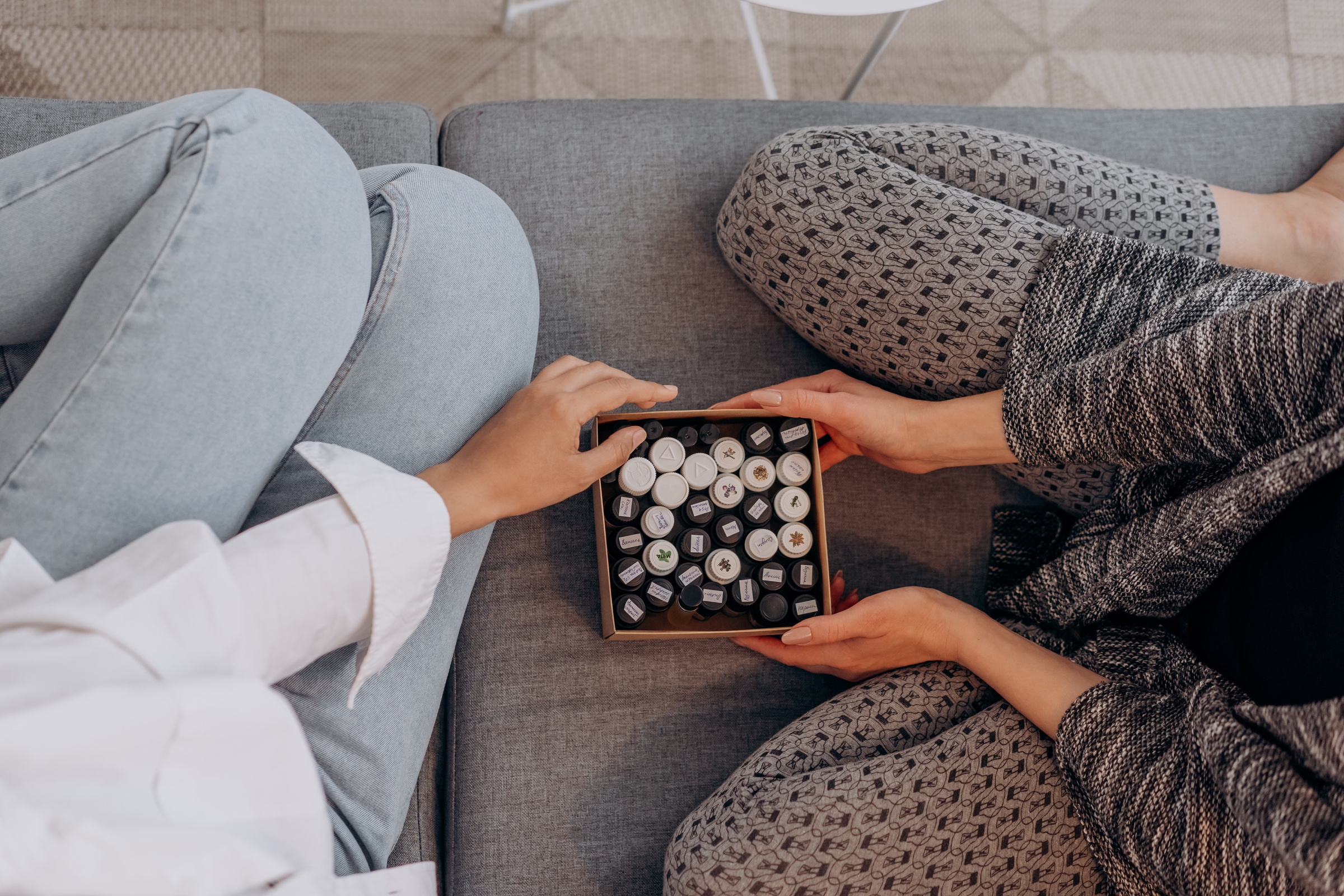 Box Of Essential OIls On A Couch