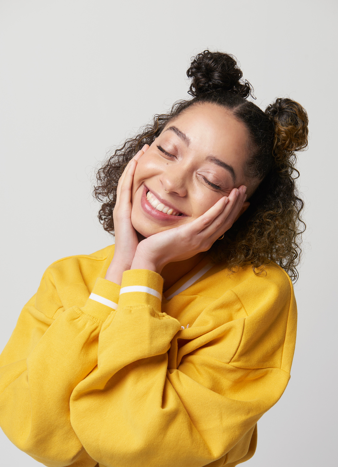 person smiling with eyes closed