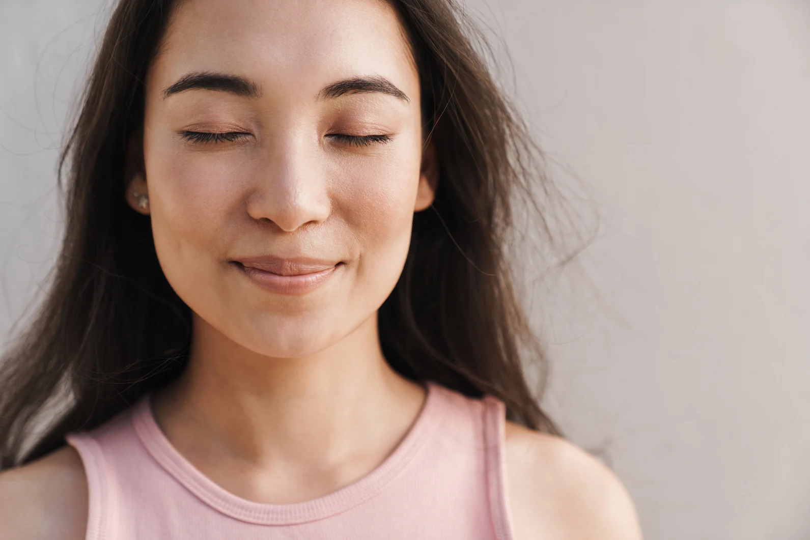 Image of Joyful Asian Beautiful Girl Smiling with Eyes Closed