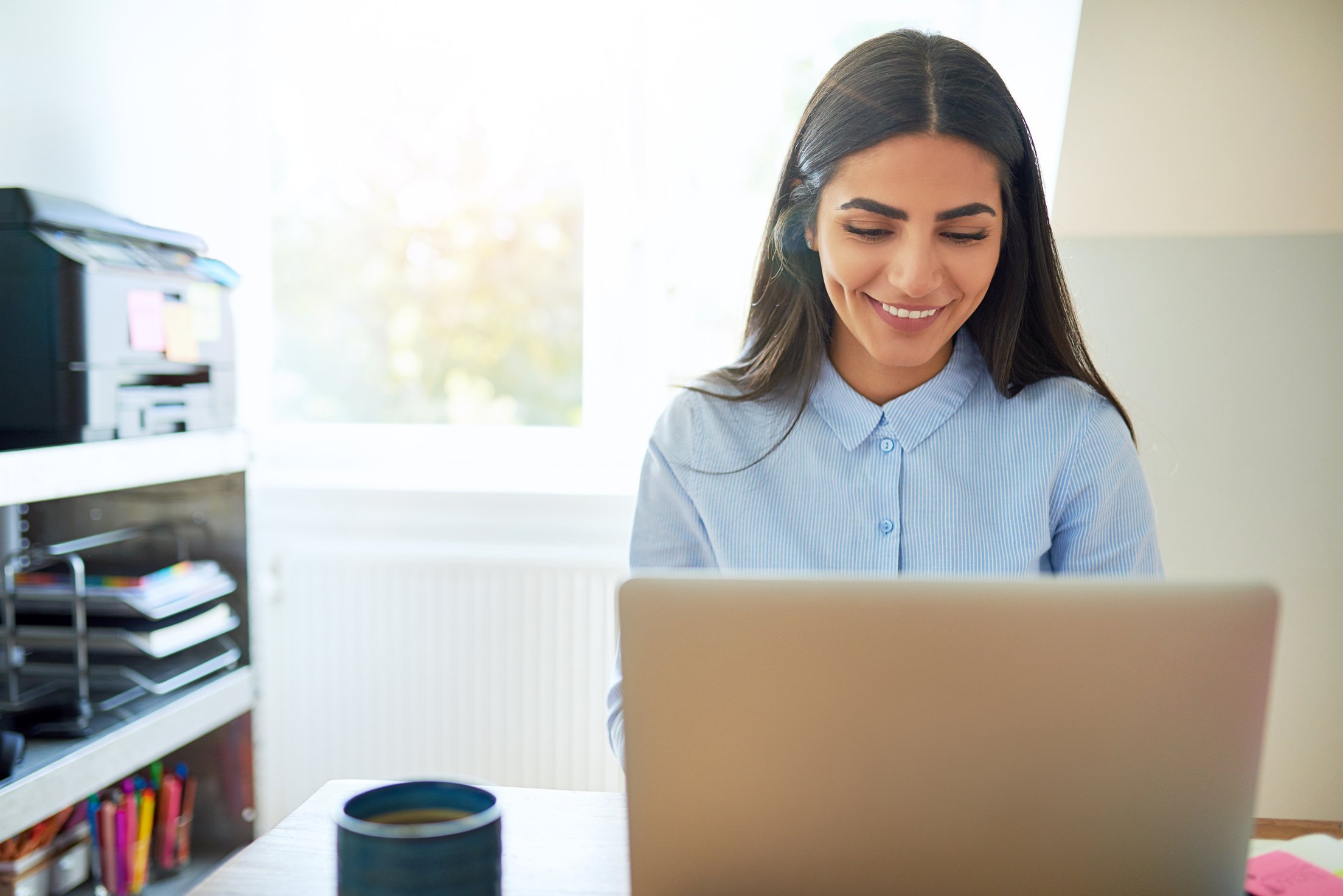  Young Indian Woman in Front of Laptop