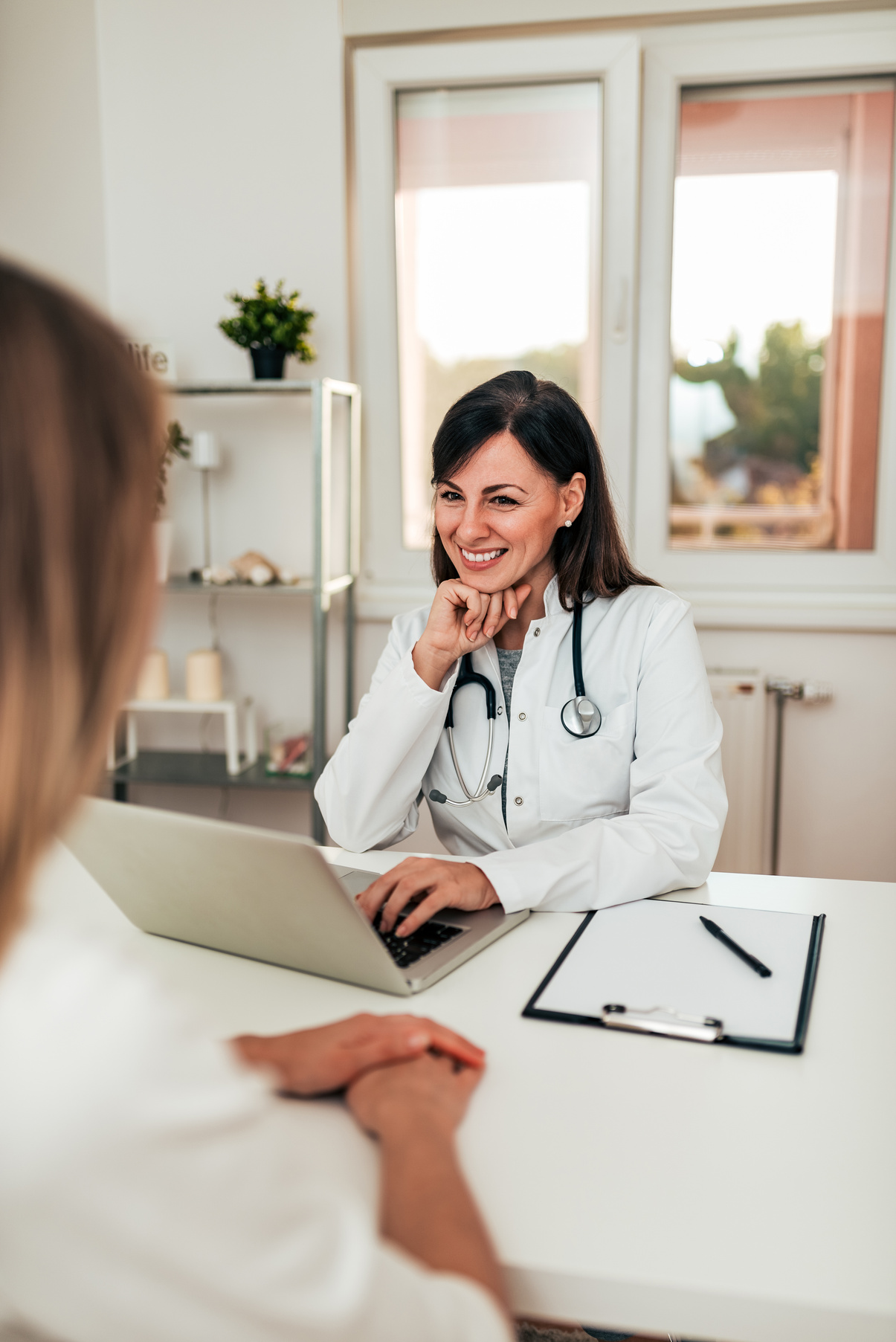 Doctor looking into patients medical history.